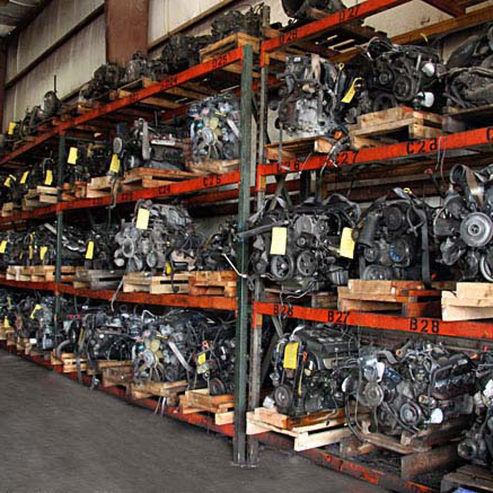 Massive warehouse shelves stocked with used engines